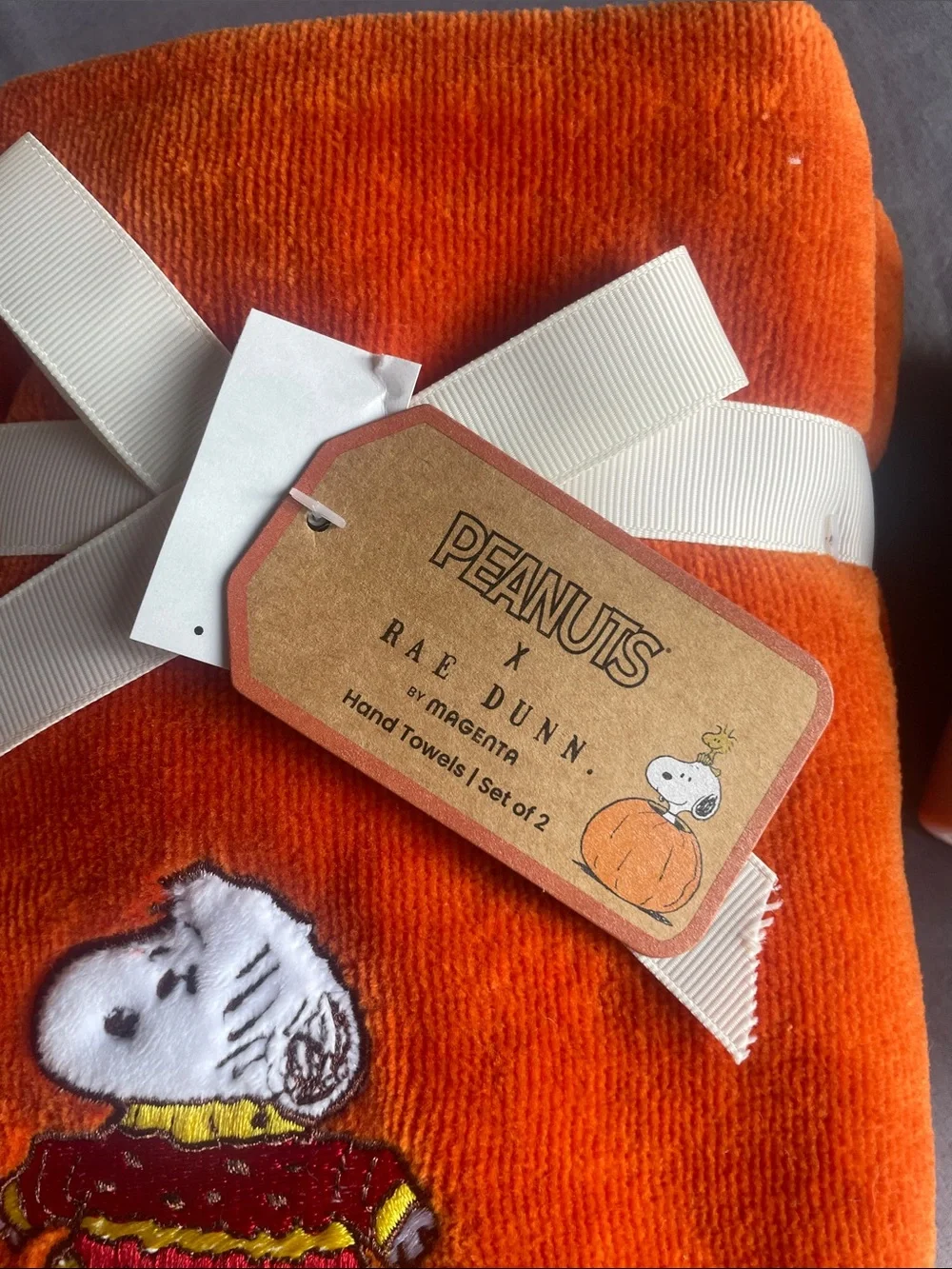 Peanuts Orange Sweater Weather Hand Towels by Rae Dunn